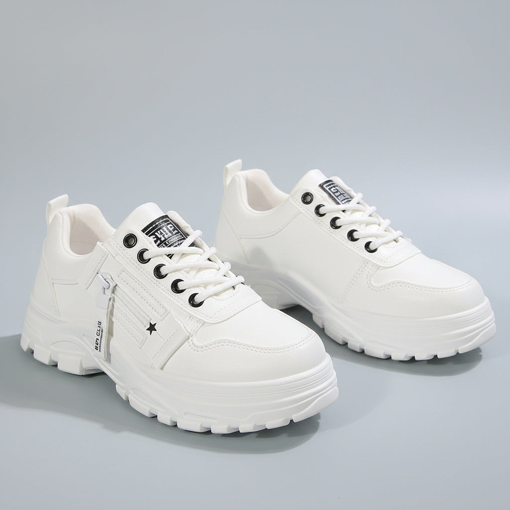 White sneakers with black details on a light background